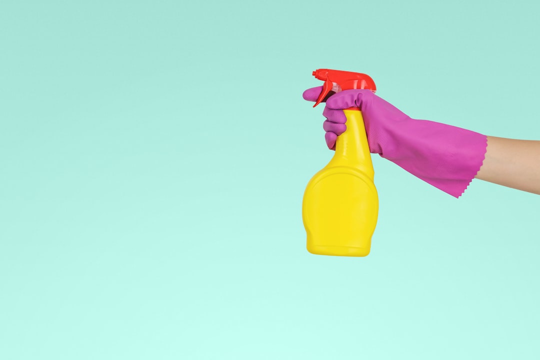 gallery-02 person-holding-yellow-plastic-spray-bottle-zmnefoi3k